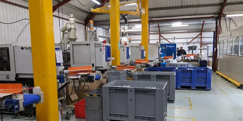 Plastic injection moulding at Broanmain showing molten polymer being injected into a steel mould