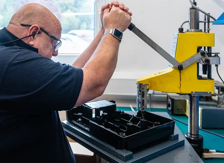 Broanmain team inspecting precision moulded plastic components in the quality laboratory